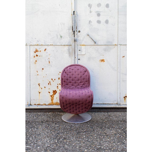 Chair with steel tube frame with upper section, aluminum base and padded fabric covering. Model System 1-2-3 Designer...