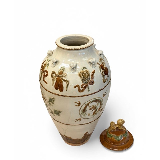 This exceptionally well-preserved Chinese pottery funerary urn dates to the Han or Six Dynasties period (circa 2nd-6th...