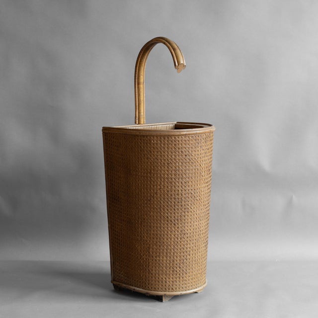 Cane ware umbrella stand with bamboo handle. Circa 1930.