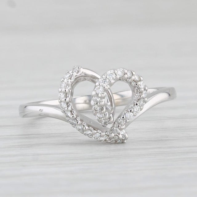 This lovely ring comes with its original inner and outer box. Gemstone Information: - Natural Diamonds - Total Carats -...