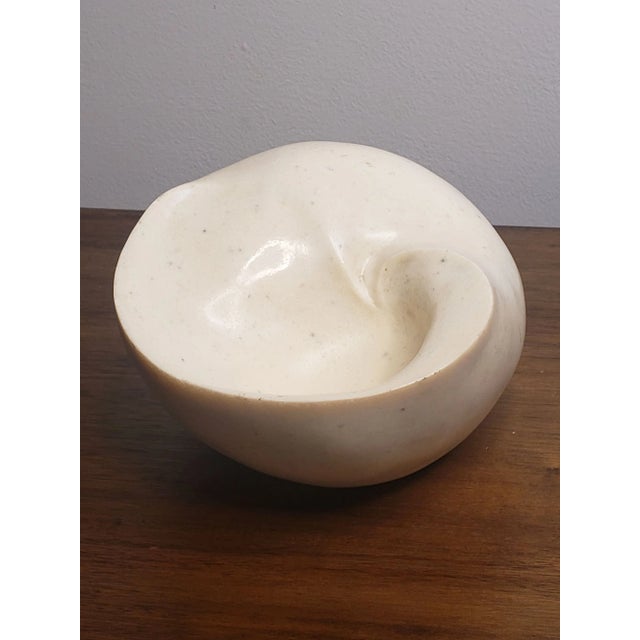 Vintage, likely c. 1980's medium sized ivory color resin, modernist biomorphic nautilus shell bowl. A rare, unique and...