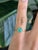 A Colombian emerald glows in vivid green at the centre of this solid 10K yellow gold estate ring, cut as a sweet heart....