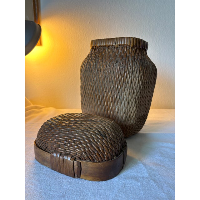 This striking woven willow fishing/ grain basket shows beautifully and is useful as well! the weaving on the sides is...