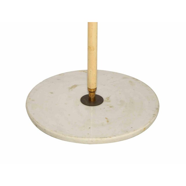 Rare early 1950s adjustable Italian floor lamp marked Stilnovo, with red enameled shade and handle. Articulated brass arm...