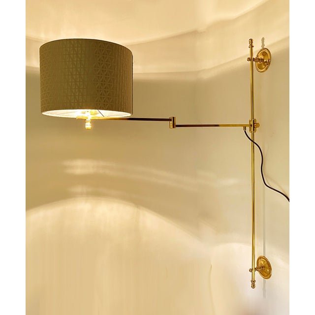Very large adjustable sconce with hight quality of material (brass & bronze ). The light feature a large rod with 2 bezels...