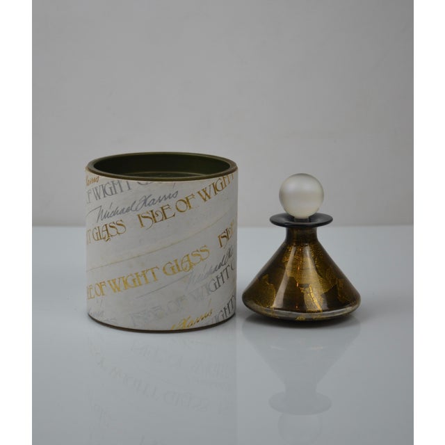 Elegant blown-glass perfume bottle created by Isle of Wight Studio Glass, the renowned British glass studio founded by...
