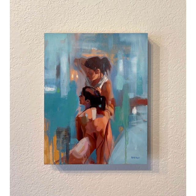 This oil on board piece captures two figures in a moment of intimate connection, their forms elegantly intertwined against...