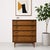 Mid Century Modern Walnut Dresser / Highboy, c. 1960's. This solid dresser offers a ton of storage space over four deep...
