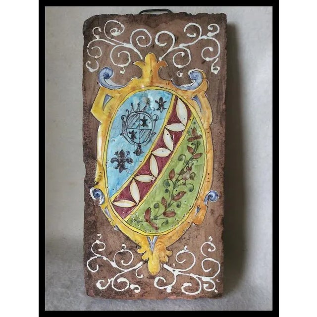 A nice French Country, Art Pottery Architectural Tile, Plaque. The Tile is handmade and hand painted with a heraldry motif...