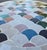 Beautiful round mosaic tile table featuring a vibrant multicolor tiled top and durable black wrought-iron style base. The...