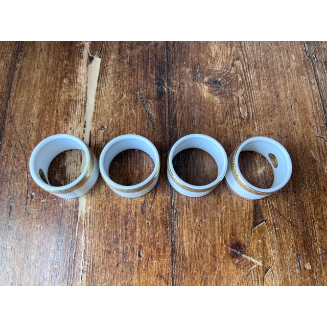 Set of 4 Gold trim and White Porcelain Napkin Ring or Napkin Holder 1 7/8” diameter and 1.25” height No chips nor crack....