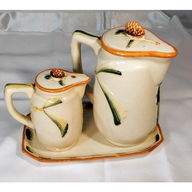 Discover this unique Americana antique set featuring a delightful five-piece pottery arrangement, perfect for adding charm...