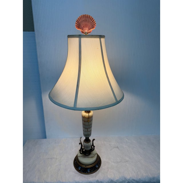 Design Plus Gallery presents Table Lamp from the Mid 20th Century. The table lamp has a body that is built on green onyx...