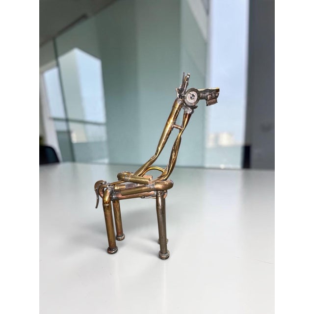 An extraordinary example of found-object assemblage art, this whimsical giraffe sculpture is handcrafted entirely from...