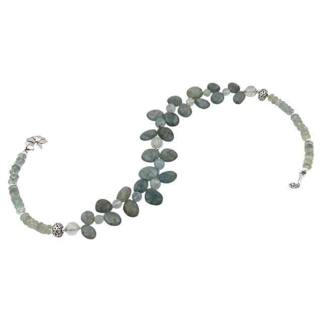 This is a varied aquamarines and sterling silver necklace. We created a laurel like strand with up to 15mm faceted...