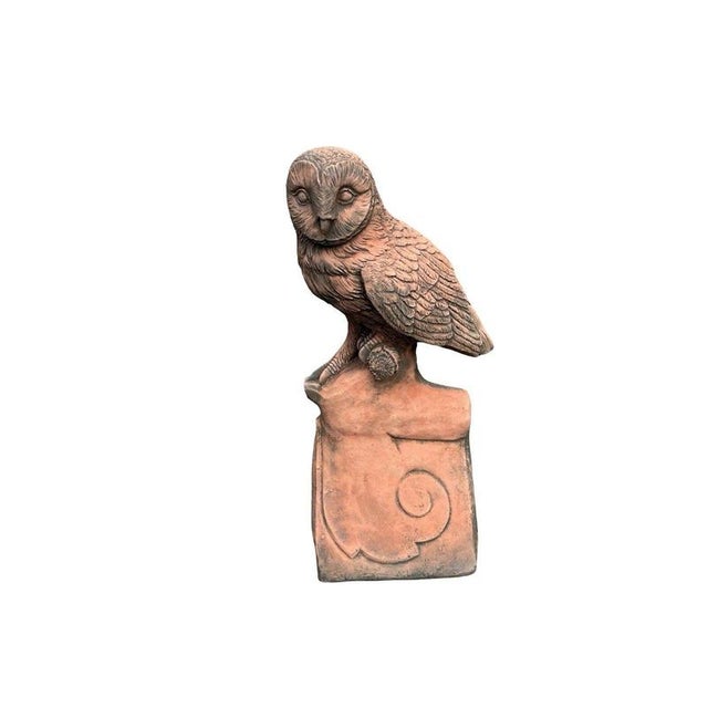 A charming architectural roof finial depicting a finely modelled owl perched upon a traditional decorative ridge tile. The...