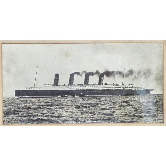 An evocative early 20th‑century rotogravure photograph of the famed Cunard ocean liner RMS Lusitania, shown cutting...