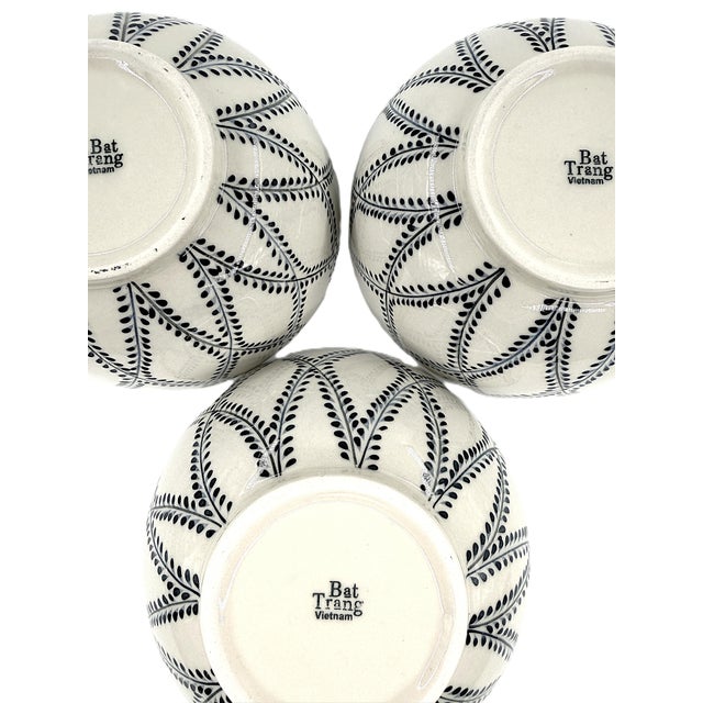 A beautiful set of four Bat Trang ceramic soup bowls, handcrafted in Vietnam and decorated with an elegant indigo-blue...