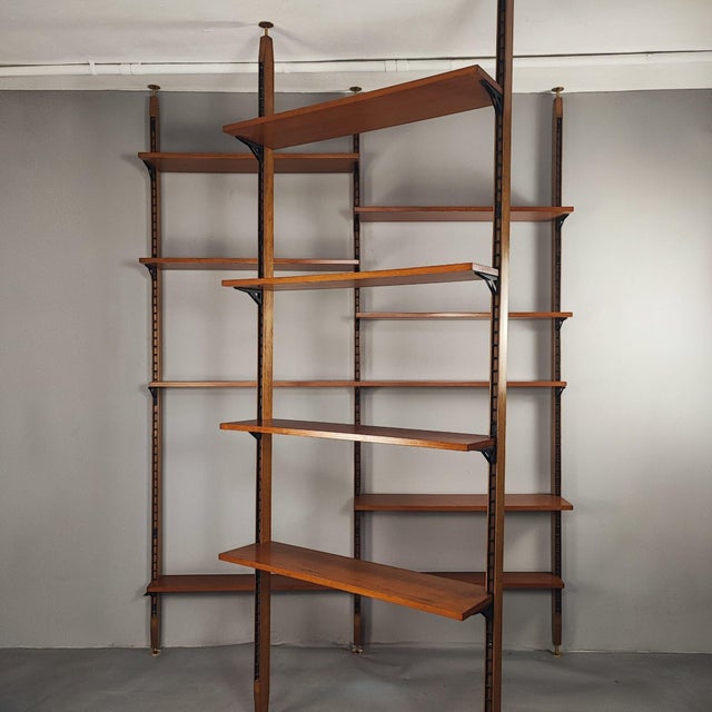 Swedish "Cielo Terra" bookcase set, Italian design from the 1960s. Available with 5 uprights and 16 shelves, creating a...