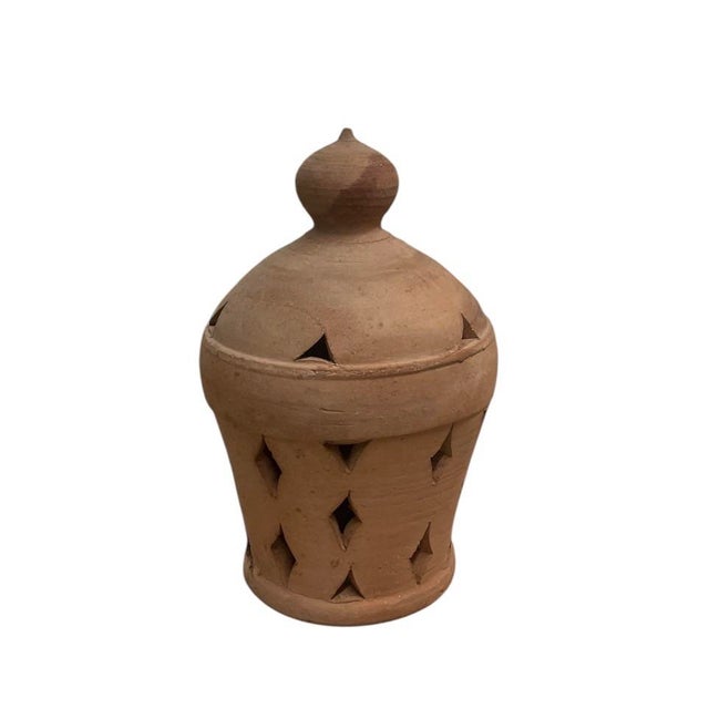 This striking, authentic Moroccan lantern is a testament to traditional pottery traditions, hand-formed from indigenous,...