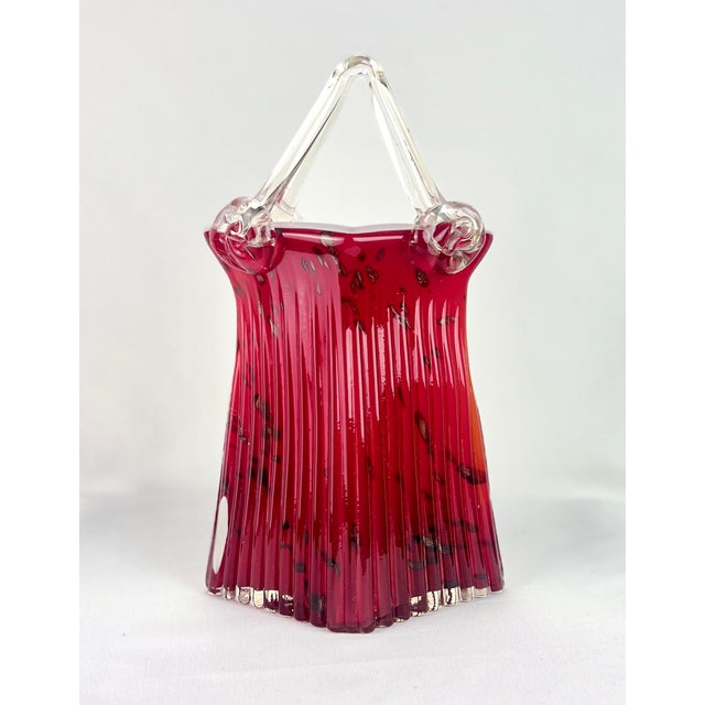 Striking vintage Murano-style art glass purse vase in a sculptural handbag form, featuring a ribbed optic body in rich...