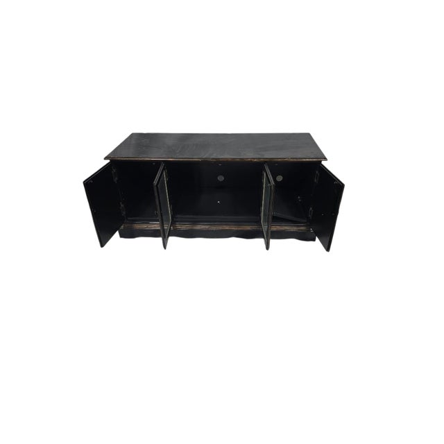 Elegant Asian-inspired black lacquer credenza featuring hand-painted bamboo panels and subtle antiqued detailing...