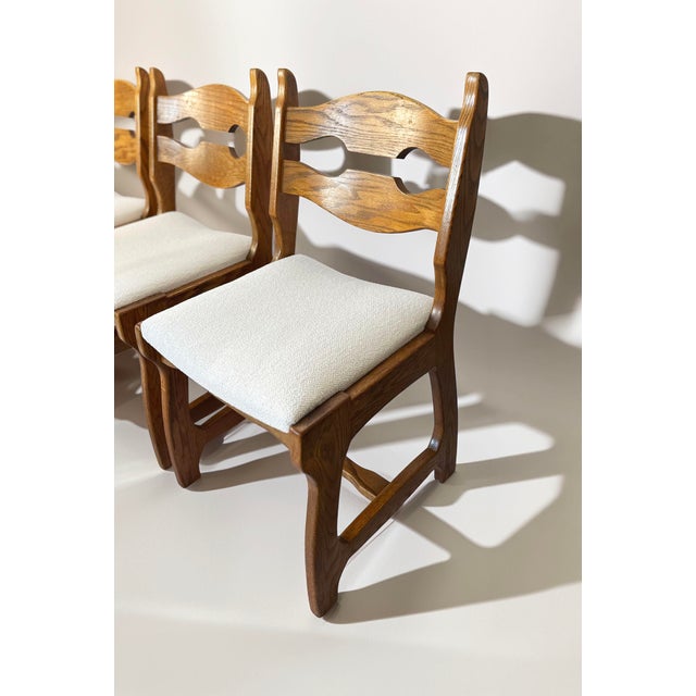 A complete set of six belgian brutalist dining chairs in solid oak, made in the 1970s, very much in the style of the...