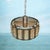 Discover this fantastic hanging lamp designed in the 60s and made in Denmark. The lamp is made of brass rings with a...