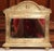 Decorate a powder room, entry, or intimate wall space with this charming antique French repoussé brass mirror, crafted...