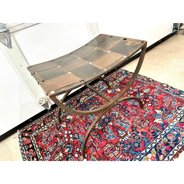 Vintage wrought iron French style curule stool.