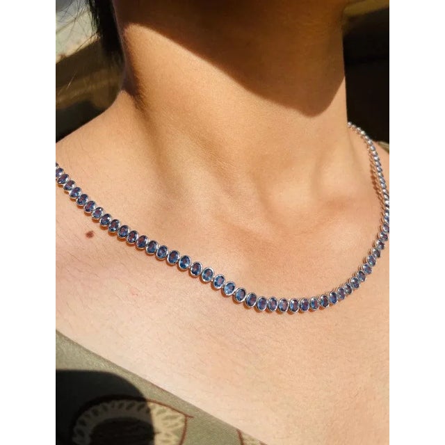 This is part of Chairish’s Fine Jewelry assortment. Blue Sapphire Necklace in 18K Gold studded with oval cut sapphire...