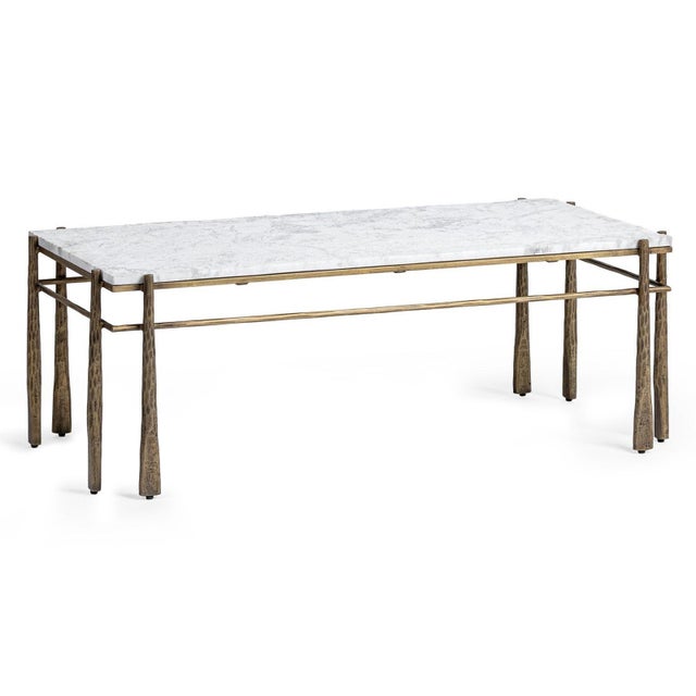 Marble and brass finished iron coffee table that blends sculptural form with refined natural materials for a striking yet...