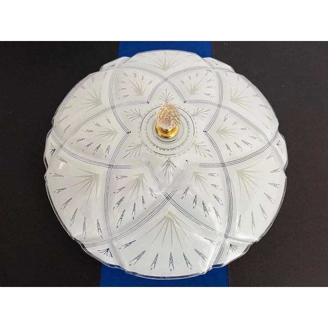 Stunning Space Age style frosted glass ceiling light designed as a big star within a star accented by radiant transparent...