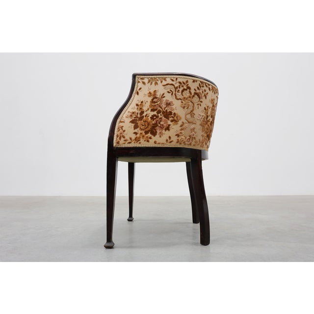 An elegant pair of French tub armchairs dating from around 1900, combining graceful proportions with refined upholstery...