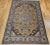 An extraordinary early 20th century Persian Tabriz rug, room-sized and masterfully hand-knotted in a rare and striking...