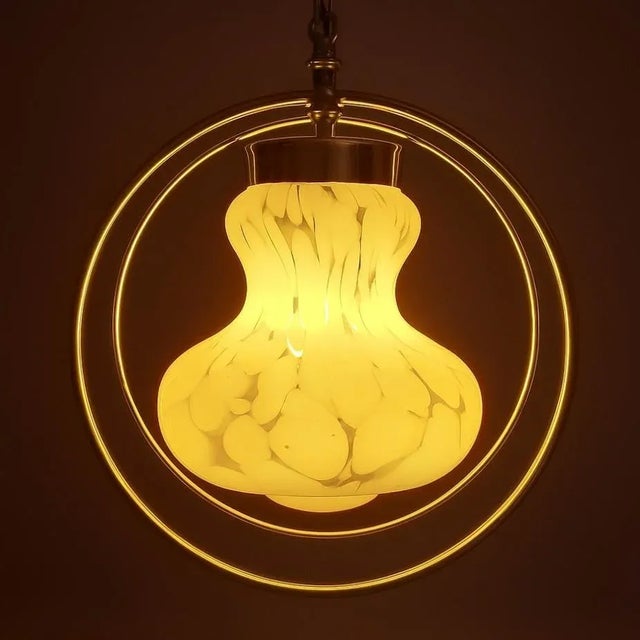 This elegant Space Age pendant chandelier features a Murano milk glass diffuser with a speckled decoration, creating a...