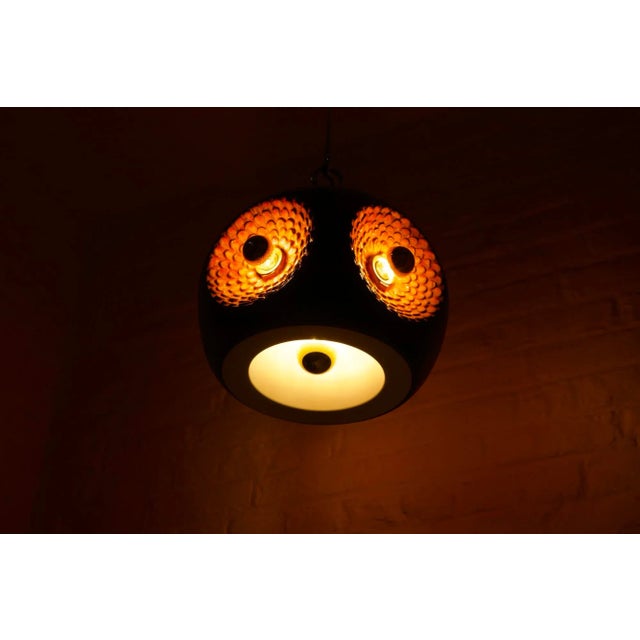 Polychrome ceramic pendant light, with 4 lights, held by a solid brass rod. Original edition from the early 1970s. 5...