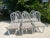Offered is a set of six vintage Henry Link Cathedral rattan dining chairs. These iconic Hollywood Regency style pieces...