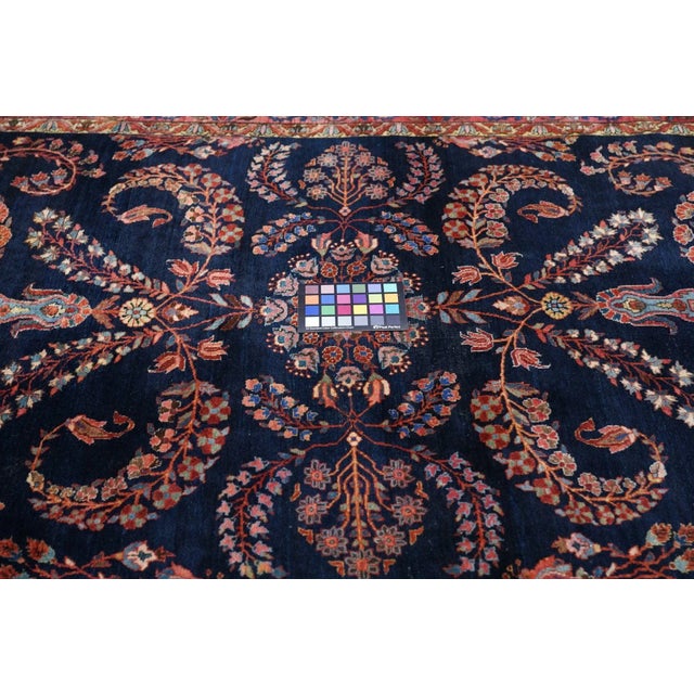 The dark blue field and fine, even weave characterizes early Interwar Sarouks from Mohajeran village. Here boteh-form...