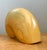 This masterfully carved nautilus shell sculpture is a quintessential example of Mid-Century Modern organic abstraction....