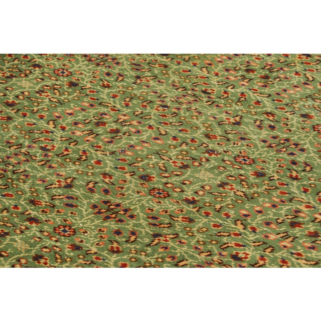 Hand-knotted in wool and originating from Turkey circa 1960 – 1970, this 7x9 vintage Zeki Müren runner rug is a unique...