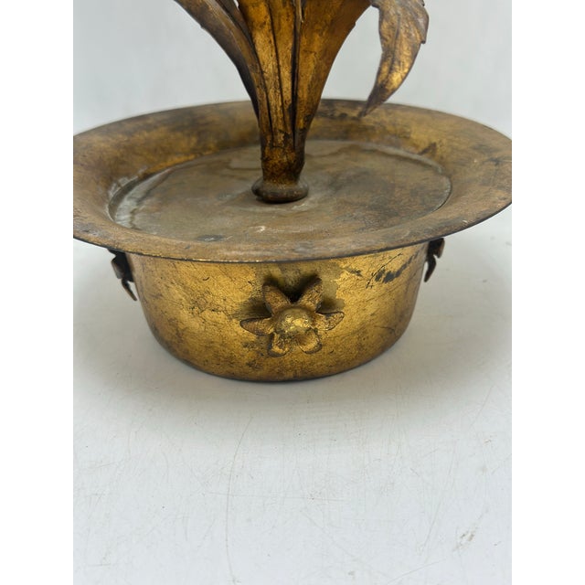 A vintage decorative metal floral arrangement sculpture. The piece features a small gilt-tone pot holding delicate metal...