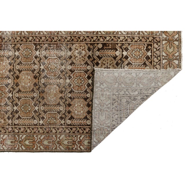 Exuding sophisticated charm and timeless craftsmanship, this exquisite 19th-century antique Malayer runner rug is a rare...