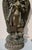 Four-armed standing figure of Manjusri with the sutra book and mala beads in the upper hands and the lower hands in mudra...