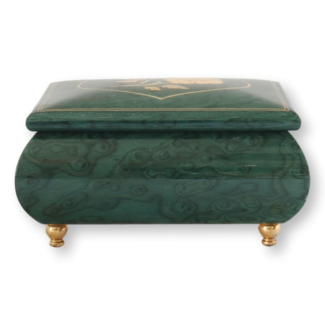 Mid 20th century Italian music box featuring an unusual green lacquered veneer with dramatic swirling grain and delicate...