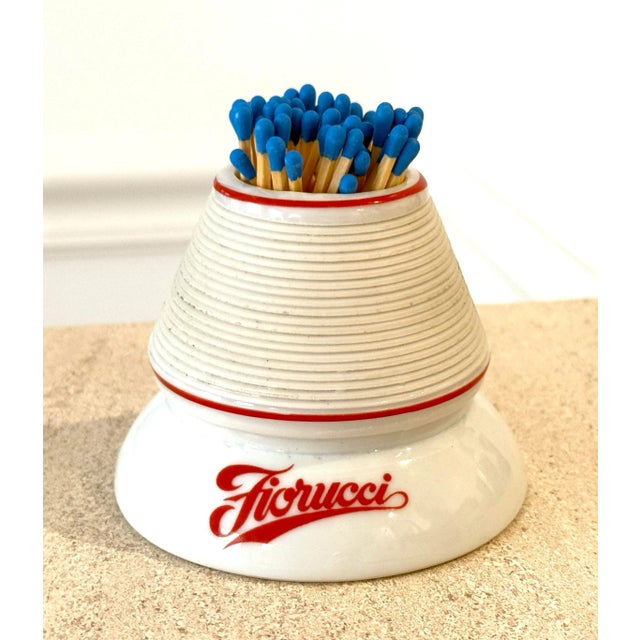 Vintage porcelain match striker made for Fiorucci in Italy. White with red lettering on two sides. Excellent condition.
