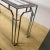 Entryway or sofa console table with a heavy chrome plated steel frame, burlwood top and beveled glass panes Attributed to...