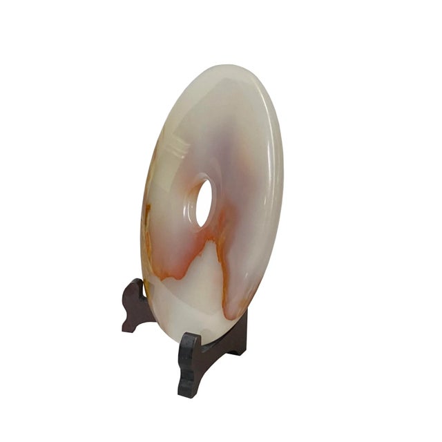 This round polished natural stone display is a unique and attractive accent piece for any home. The stone is polished to a...