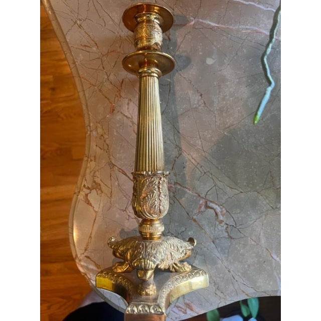 This is a 19th century French Neoclassical candlestick crafted from ormolu (gilt bronze). It features refined, chiseled...