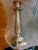 This is a 19th century French Neoclassical candlestick crafted from ormolu (gilt bronze). It features refined, chiseled...